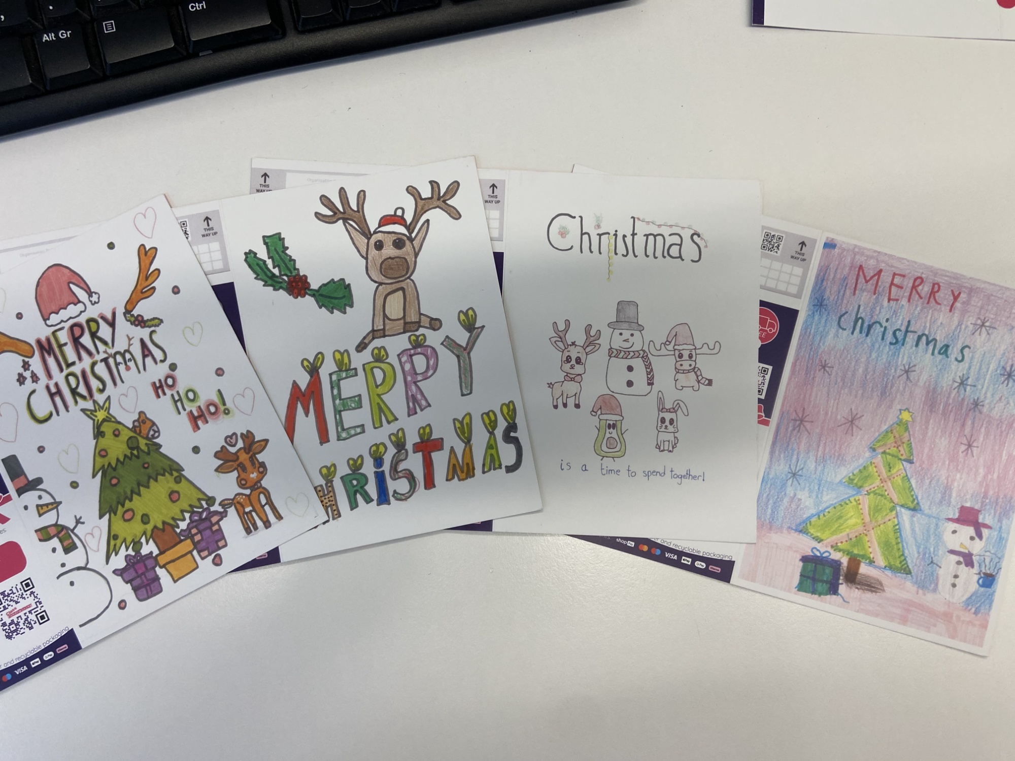 Photo showing christmas cards designed by children
